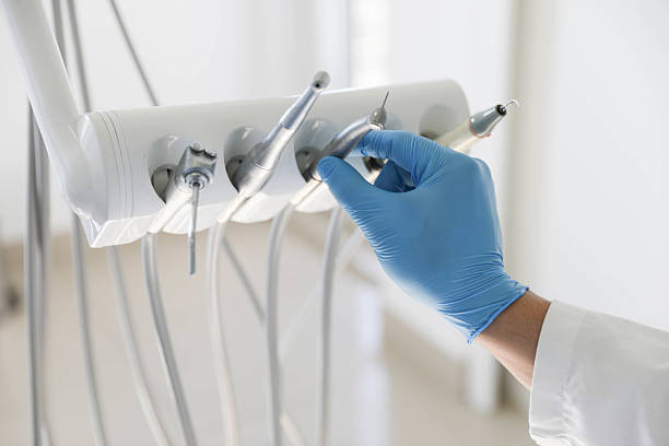 Professional Tooth Extraction technician working in Flora, IL